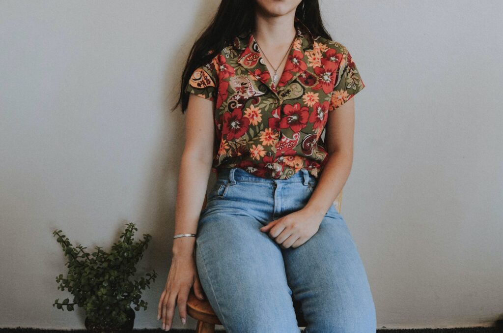 Woman Sitting on Chair Beside Green Plant