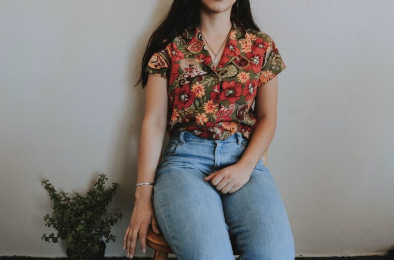 Woman Sitting on Chair Beside Green Plant