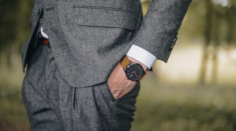 Man Wearing Watch With Hand on Pocket